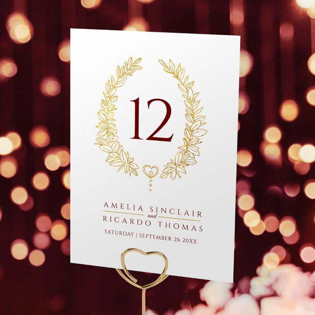 Oval wreath leaf gold white dark red text wedding table number (Creator Uploaded)
