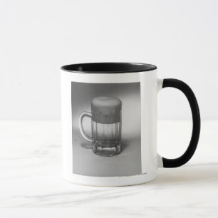 Overflowing beer glass mug