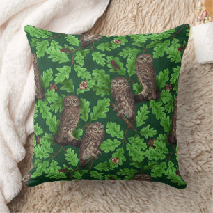 Owls in the forest on dark green cushion