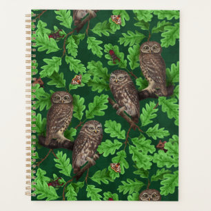 Owls in the forest on dark green planner