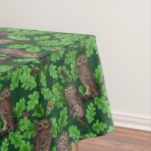 Owls in the forest on dark green tablecloth