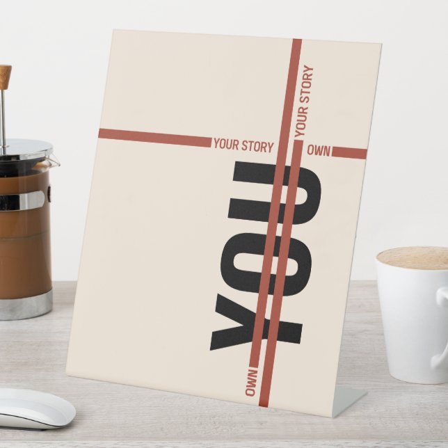 Own Your Story Shirt – Bold Motivational Quote Pedestal Sign (In SItu)