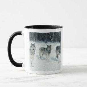 Pack of wolves at edge of snowy forest mug