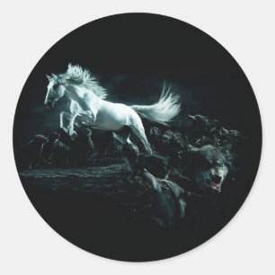 Pack of wolves attacking a white horse classic round sticker