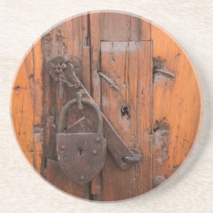 Padlock on wooden door coaster