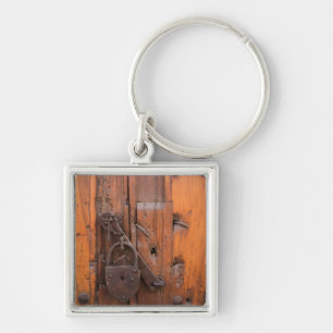 Padlock on wooden door key ring