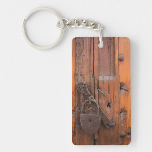 Padlock on wooden door key ring