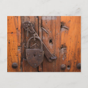 Padlock on wooden door postcard