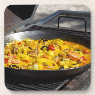 Paella is cooked on a grill coaster