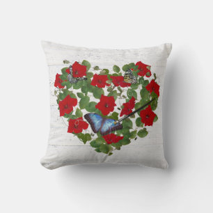 paint brush with butterfly on red petunia heart cushion