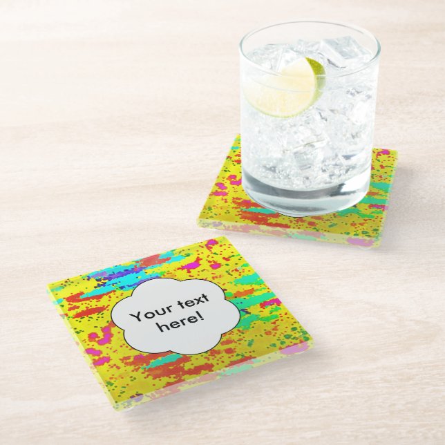Paint splashes on a yellow background glass coaster (Angled)