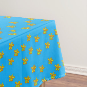 painted flowers on blue tablecloth