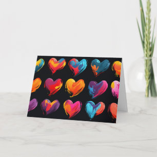 Painted hearts on a black background holiday card
