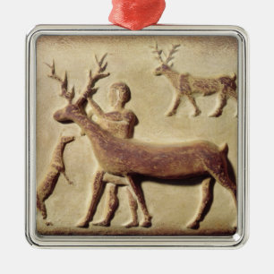 Painted relief depicting a man with deer metal ornament