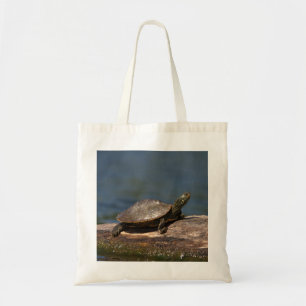 Painted turtle on a log tote bag