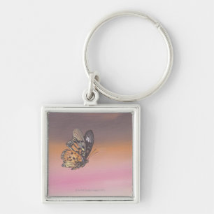 Painting depicting butterfly in flight key ring