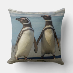 Pair of penguins on the beach cushion