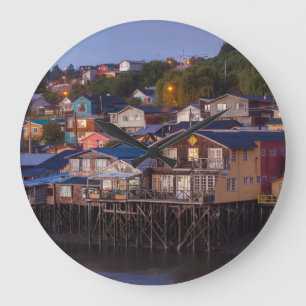 Palafito stilt houses, elevated view large clock