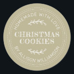 Pale Olive Green Homemade Christmas Cookies Classic Round Sticker<br><div class="desc">Add a warm,  handmade touch to your holiday gifts with this Pale Olive Green Christmas Cookies sticker. Featuring a rustic stitched design and personalized name detail,  it’s perfect for labeling homemade cookies,  baked goods,  and festive treats. A charming choice for home bakers or small shops spreading holiday cheer.</div>