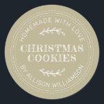 Pale Olive Green Homemade Christmas Cookies Classic Round Sticker<br><div class="desc">Add a warm,  handmade touch to your holiday gifts with this Pale Olive Green Christmas Cookies sticker. Featuring a rustic stitched design and personalized name detail,  it’s perfect for labeling homemade cookies,  baked goods,  and festive treats. A charming choice for home bakers or small shops spreading holiday cheer.</div>
