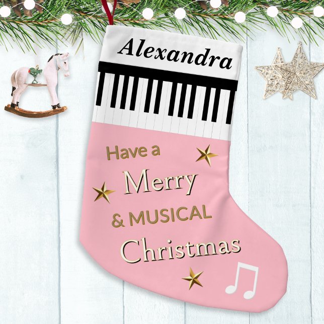 Pale Pink Cute Festive Piano Keys Personalised Small Christmas Stocking (A personalized Christmas stocking in pink, with piano keys, festive greeting, stars and music notes)