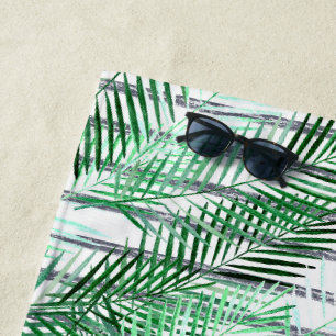 Palm leaves on a striped black and white backgroun beach towel