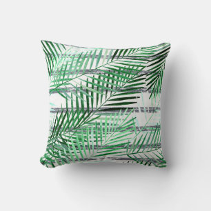 Palm leaves on a striped black and white backgroun cushion