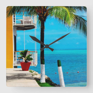 Palm Tree At The Front Yard Of A House By The Sea Square Wall Clock