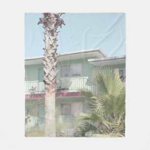 PALM TREE NEAR WHITE CONCRETE HOUSE FLEECE BLANKET