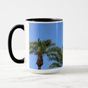 Palm trees against the blue sky photo  mug