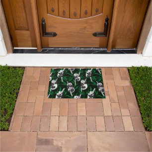 Panda cubs on dark green doormat
