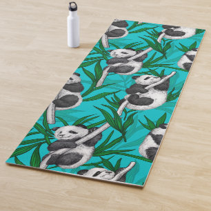 Panda cubs on turquoise yoga mat