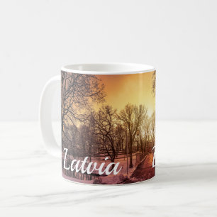 Panoramic view of snowy park during sunset in Riga Coffee Mug