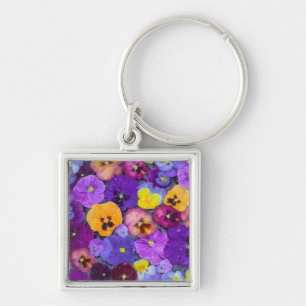 Pansy flowers floating in bird bath with dew key ring