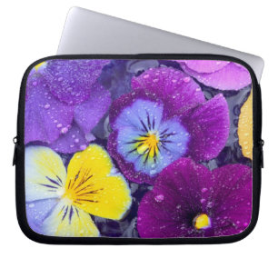 Pansy flowers floating in bird bath with dew laptop sleeve