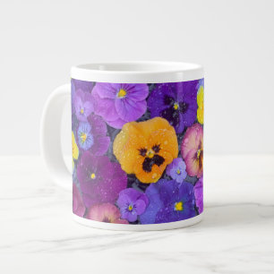 Pansy flowers floating in bird bath with dew large coffee mug