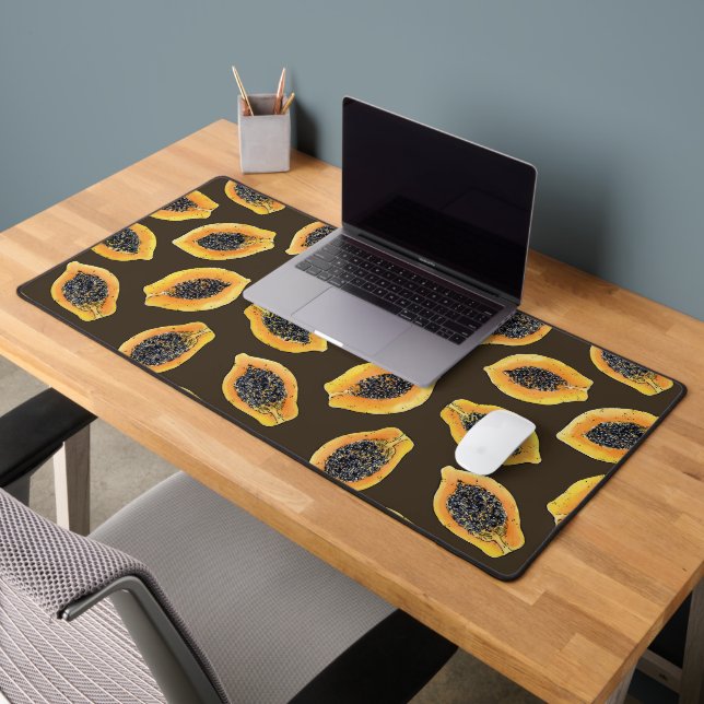 Papaya slices on dark brown desk mat (Office 2)