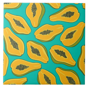 Papaya slices on turquoise ceramic tile