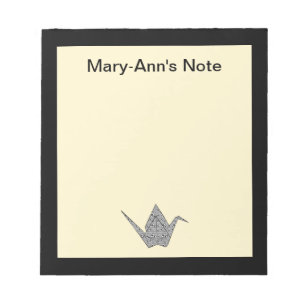 Paper crane with black hearts and flowers pattern notepad