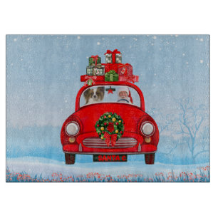 Papillon Dog In Car With Santa Claus  Cutting Board