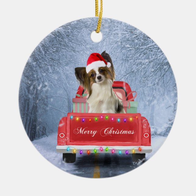 Papillon Dog in Snow sitting in Christmas Truck  Ceramic Ornament (Front)