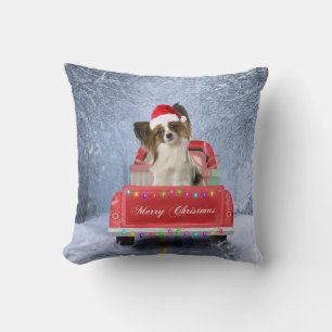 Papillon Dog in Snow sitting in Christmas Truck  Cushion