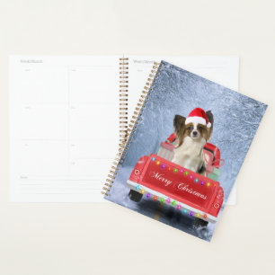 Papillon Dog in Snow sitting in Christmas Truck Planner