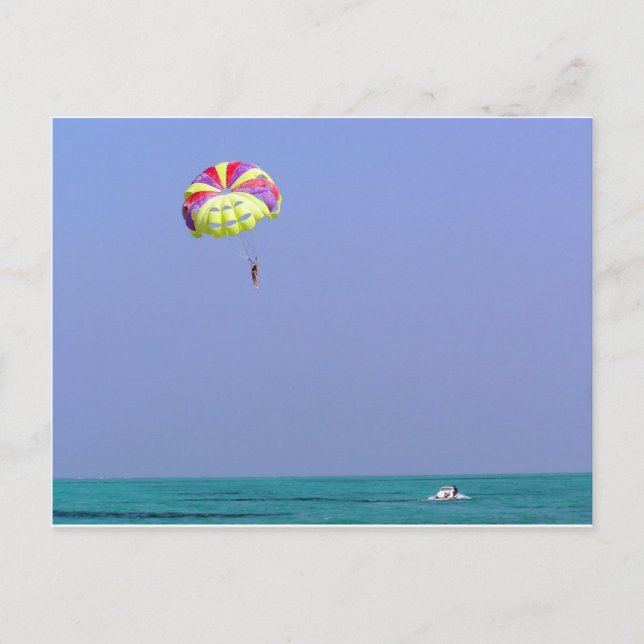 Parasailing over the blue water postcard (Front)