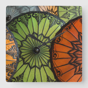 parasols for sale, bagan, myanmar square wall clock