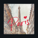 Paris Magnet<br><div class="desc">This elegant and stylish magnet shows a watercolor sketch painting of the iconic Eiffel Tower as seen through a side street - evoking memories of travels in Paris and French street life! The word “Paris” in bright red with a heart adds a stylish and modern touch - you can easily...</div>
