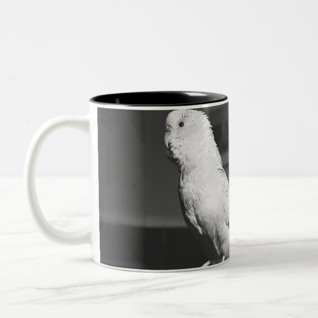 Parrot sitting on candlestick B&W Two-Tone Coffee Mug (Left)