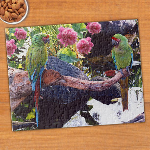 Parrots on branch with pond, rocks, flowers jigsaw puzzle