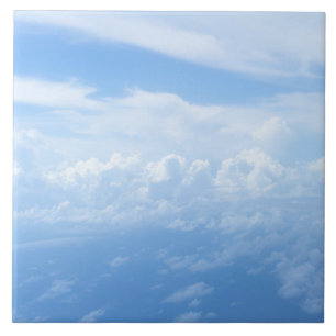 Pastel blue sky, fluffy white clouds ceramic tile
