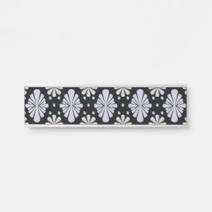 Pastel floral shapes on a black background door sign